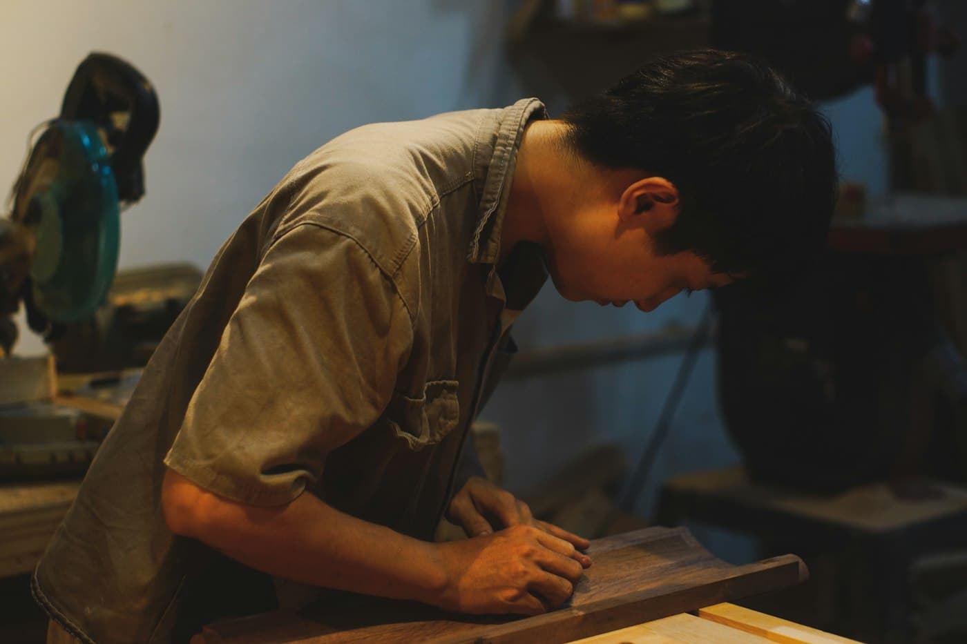 A carpenter at the bench, shaping wood by hand